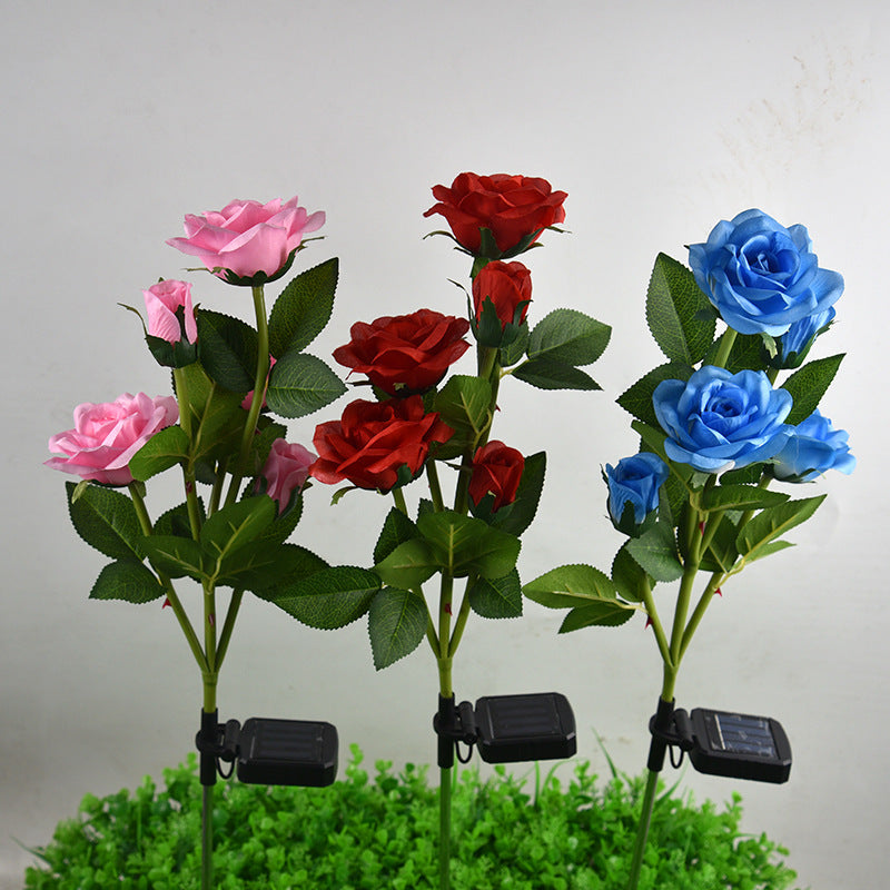 Colorful LED solar rose garden lamp with red, pink, and blue roses for outdoor decoration