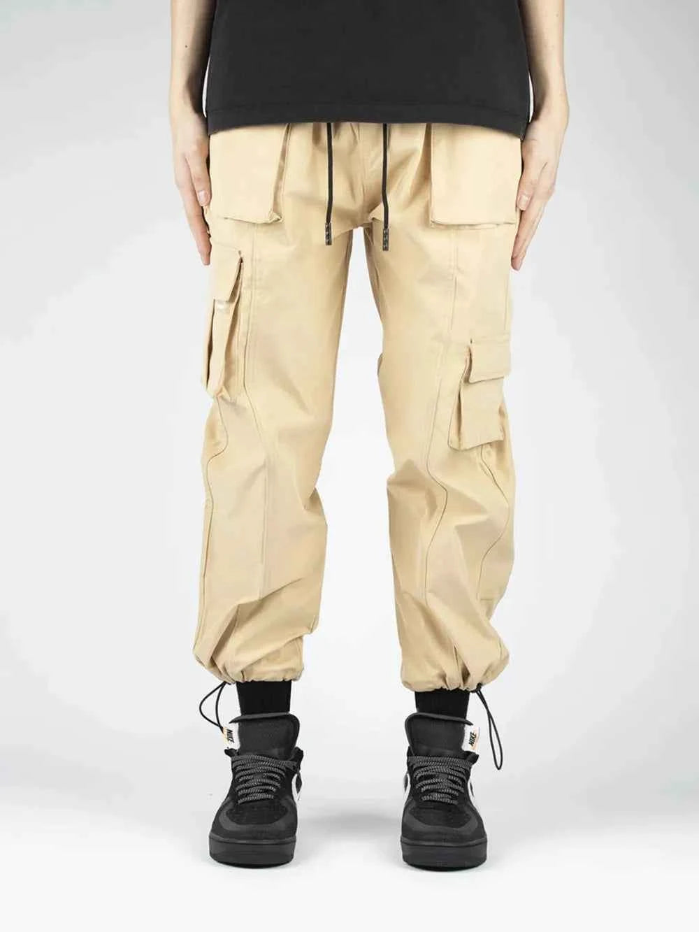 Men's drawstring cargo pants in beige with multiple pockets and elastic cuffs for a stylish look