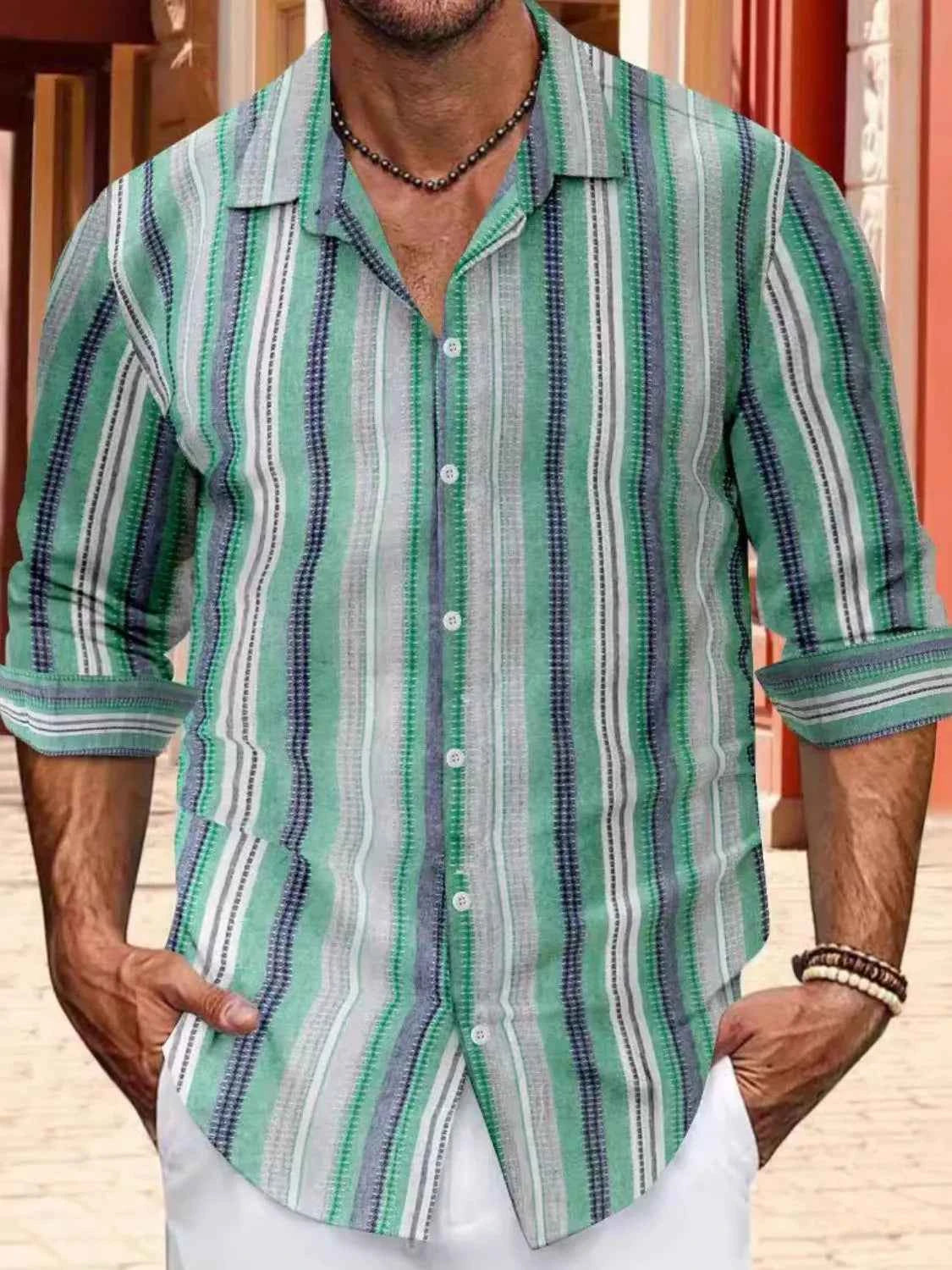 Men's striped button up shirt in green and blue with a relaxed fit and rolled sleeves
