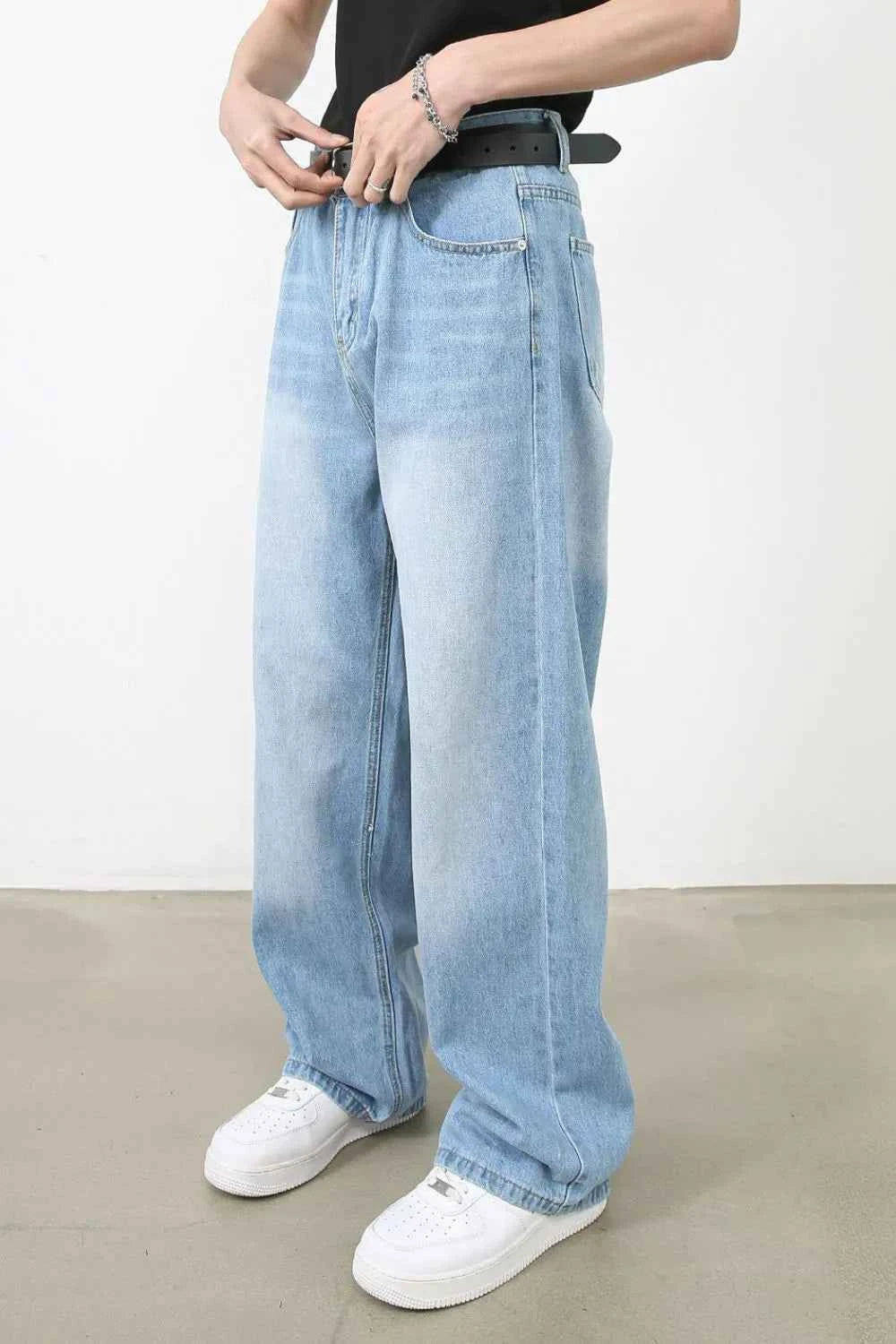 Light blue men's wide jeans with pockets, featuring a relaxed fit and comfortable design