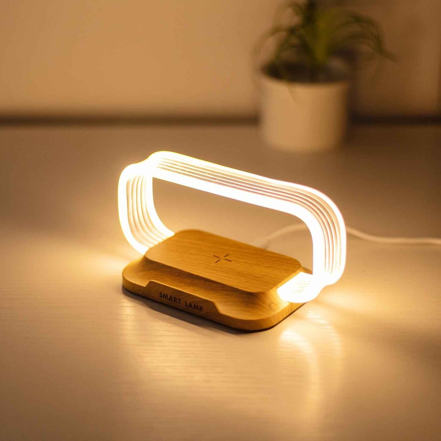 Stylish 10W wireless charging lamp with modern design and soft glow for versatile use