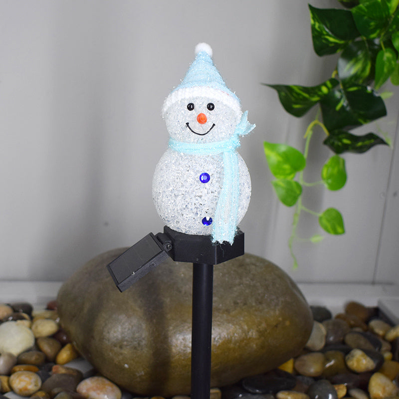 Cute solar snowman garden lamp with a blue scarf and hat, perfect for festive outdoor decor