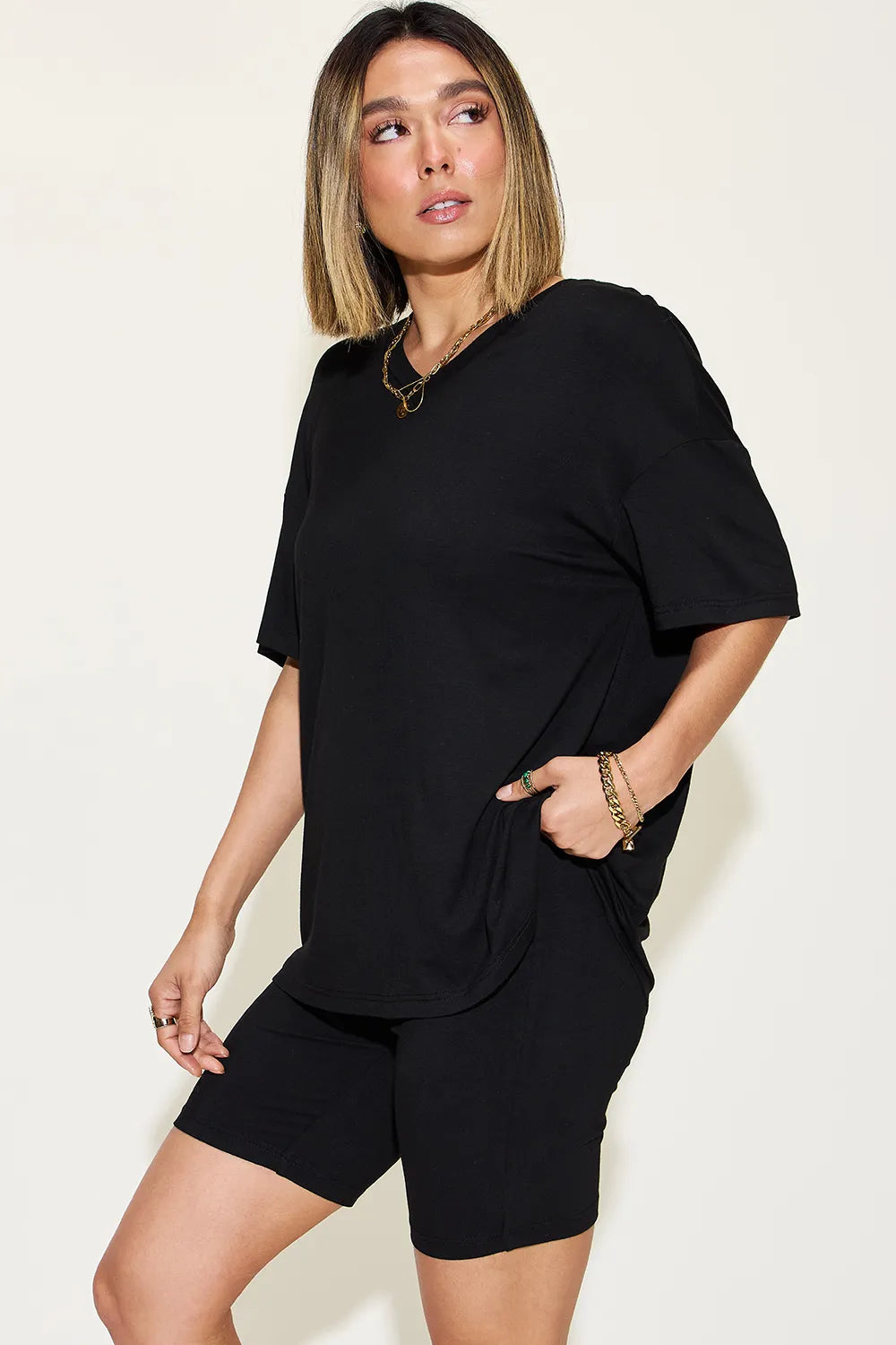 Stylish black trendy lounge wear for women featuring a relaxed top and shorts set