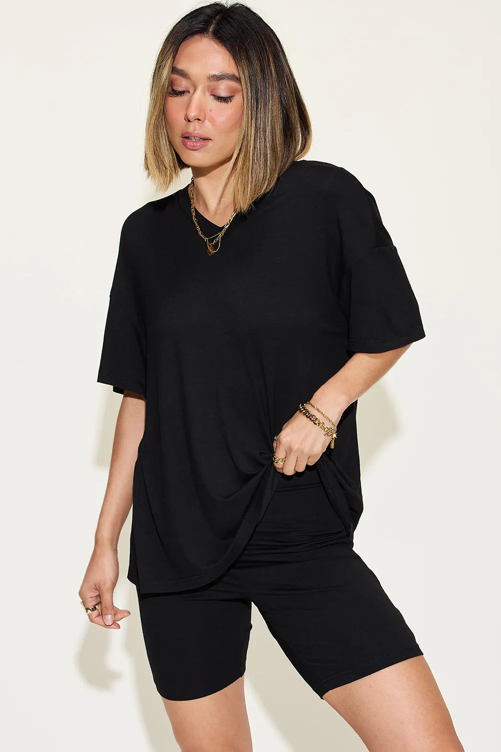 Black trendy lounge wear for women featuring a loose top and fitted shorts