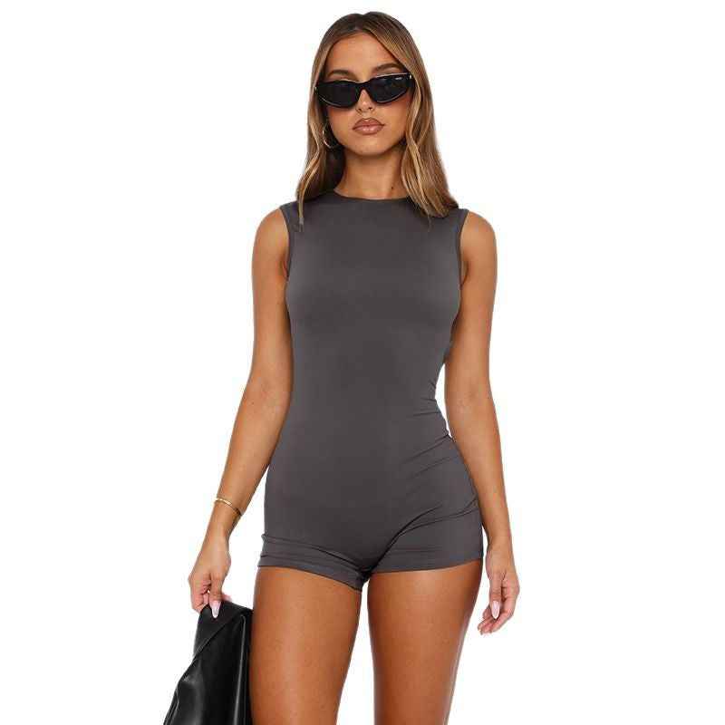 Stylish model wearing a slim-fit sports jumpsuit in gray, perfect for workouts or casual outings