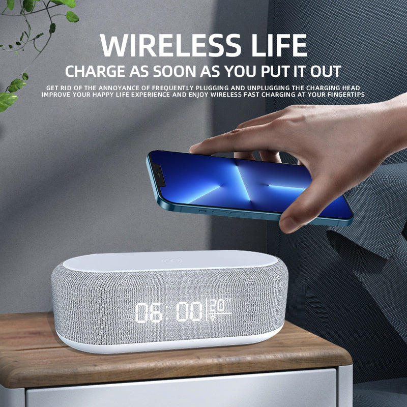 Modern wireless charging dock with alarm clock displaying time and charging smartphone on a bedside table