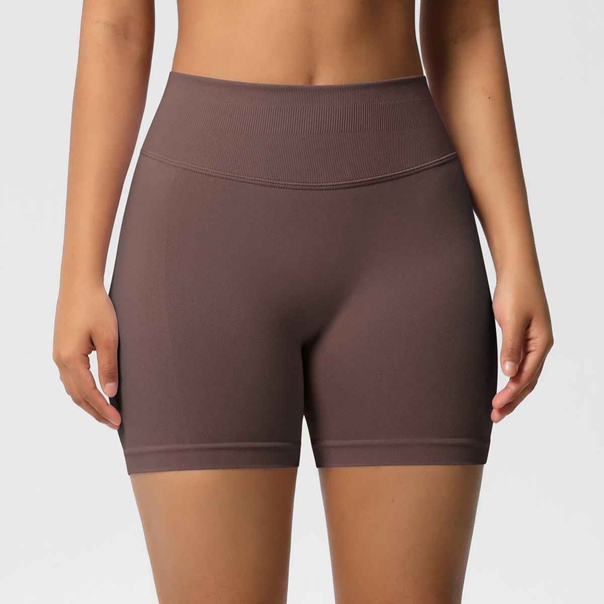 Women's seamless fitness shorts in brown, designed for comfort and flexibility during workouts