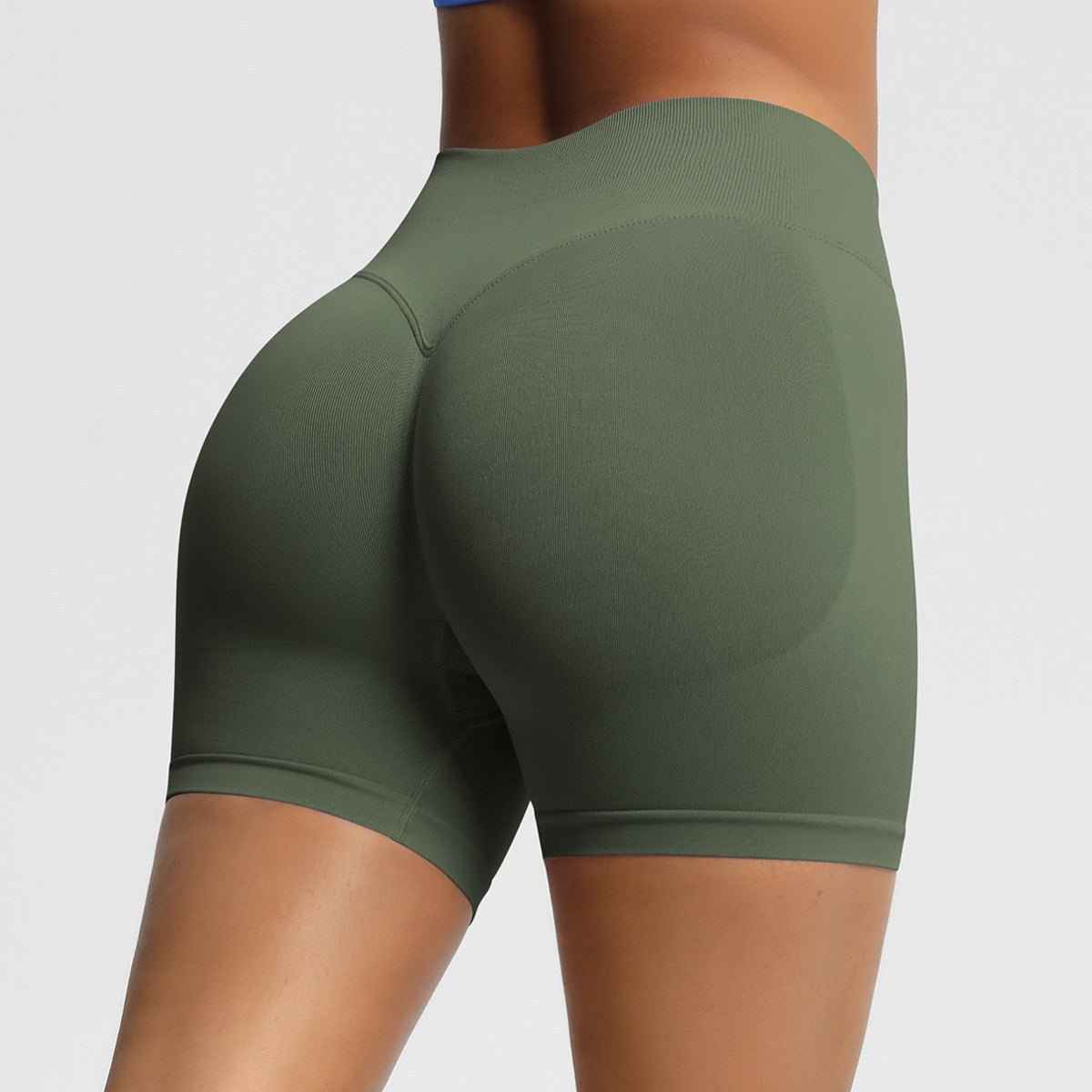 Women's seamless fitness shorts in olive green for comfortable workouts and mobility