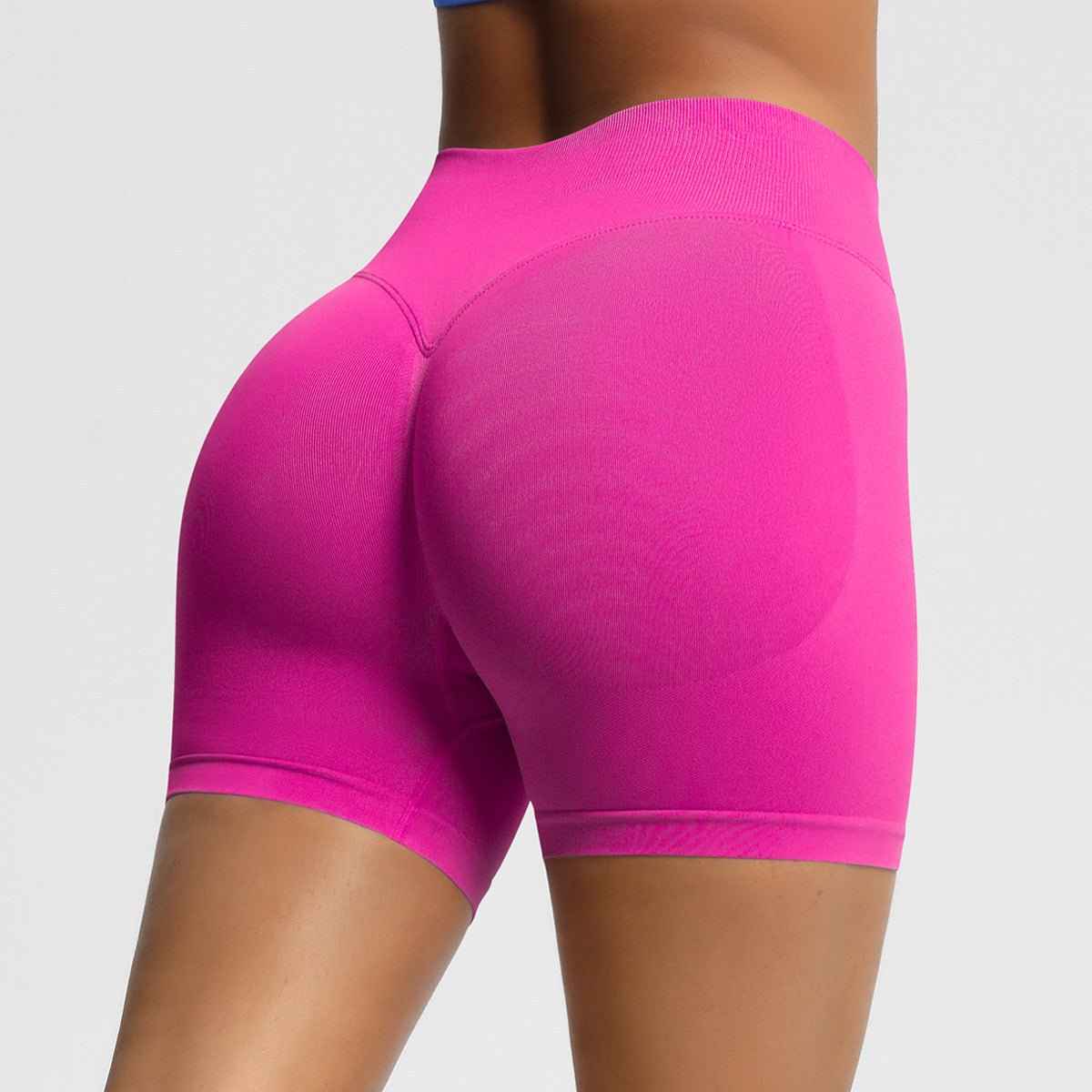 Women's seamless fitness shorts in vibrant pink for comfortable and stylish workouts