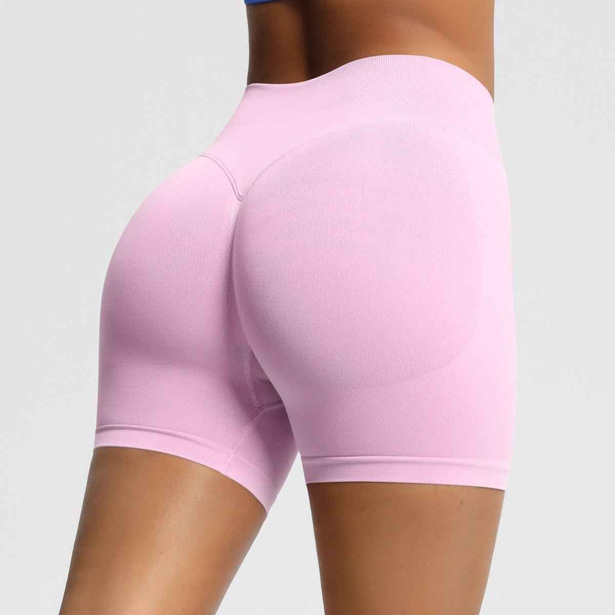Women's seamless fitness shorts in soft pink for comfort and flexibility during workouts
