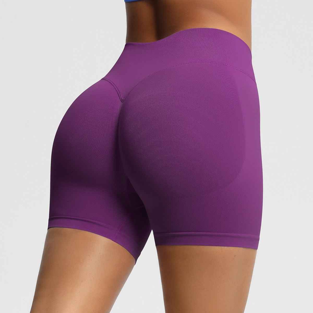 Women's seamless fitness shorts in purple designed for comfort and flexibility during workouts
