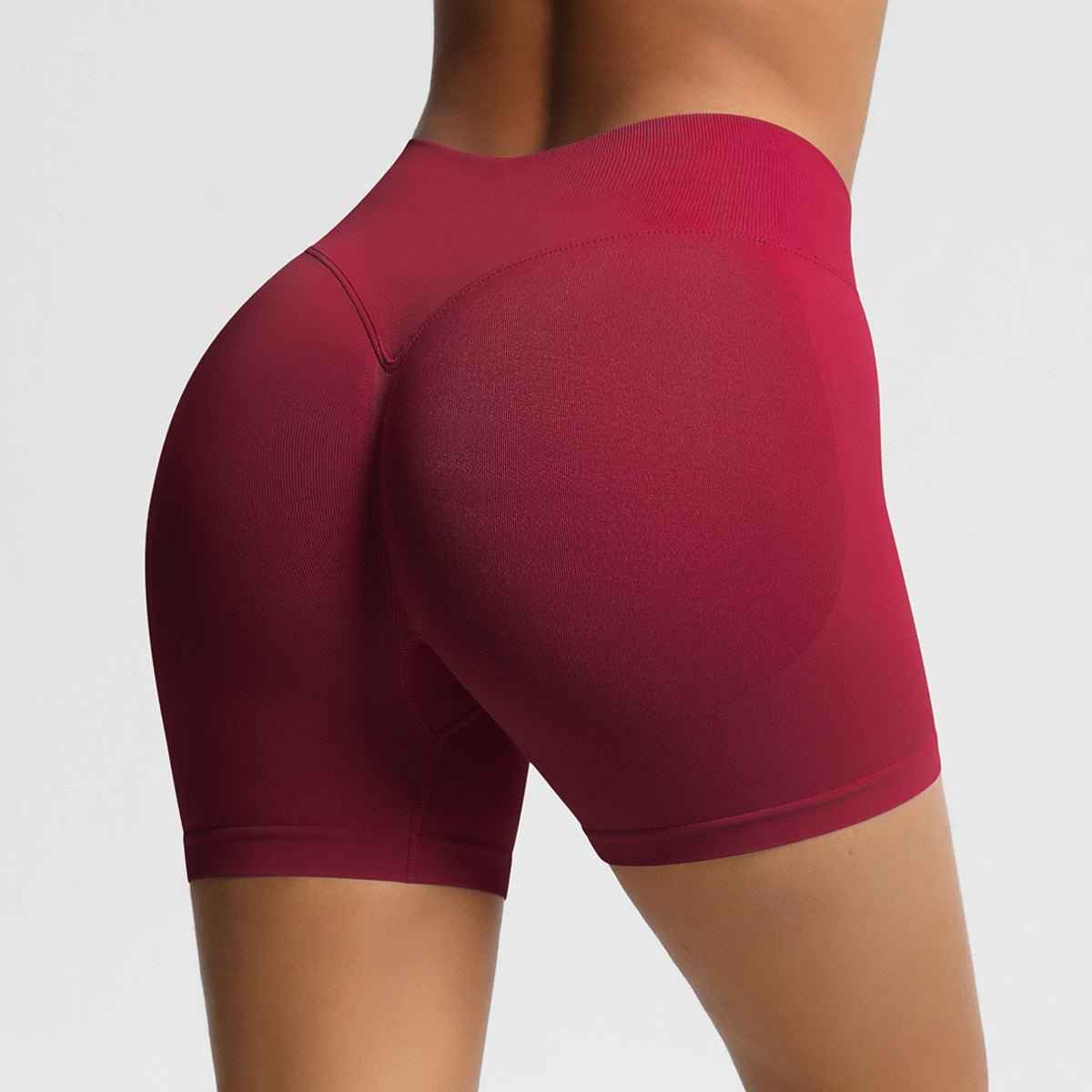 Burgundy women's seamless fitness shorts designed for comfort and flexibility during workouts