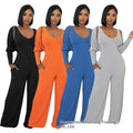 Signature Twisted Backless Long Sleeve Jumpsuit