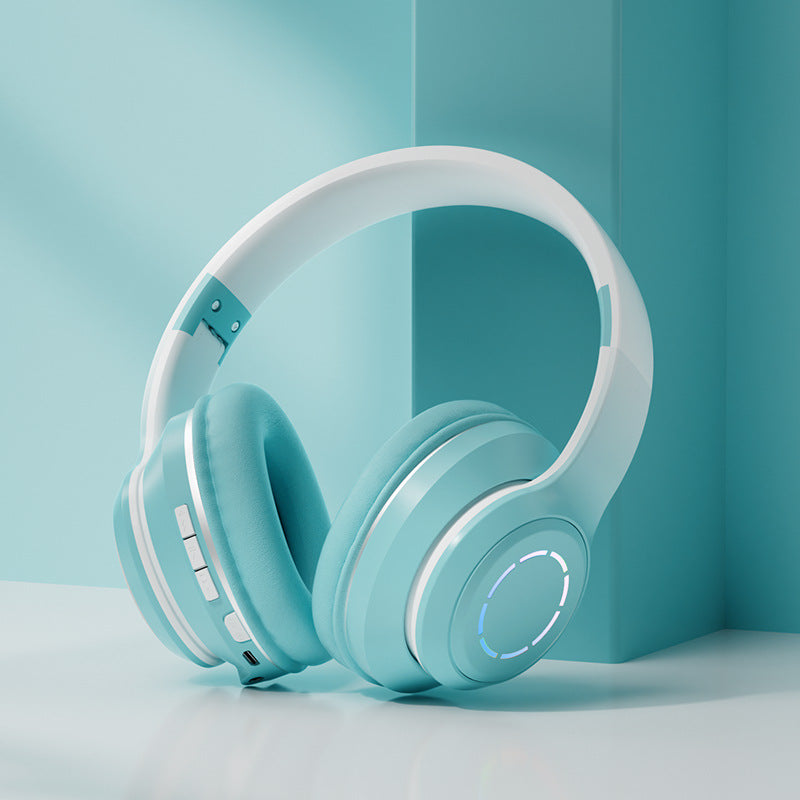 Gradient Bluetooth headphones in teal and white with touch controls and cushioned ear pads