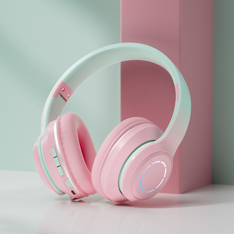 Stylish gradient Bluetooth headphones in pink and mint green for a modern listening experience