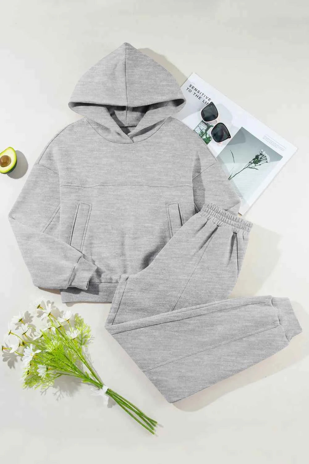 Trendsi grey tracksuit for women featuring a hooded sweatshirt and matching joggers