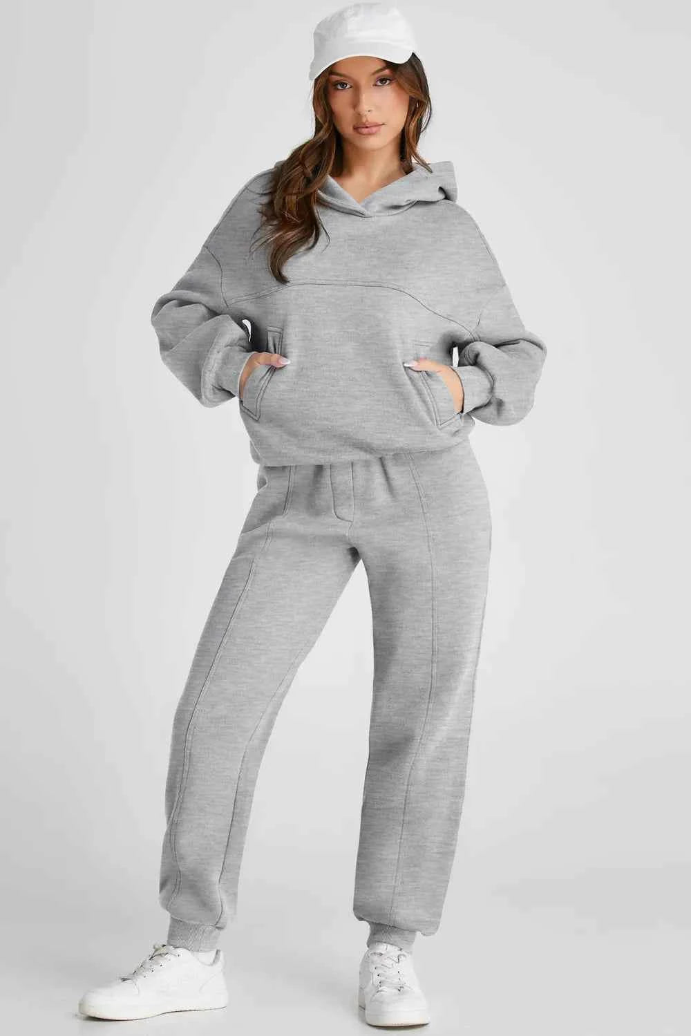 Stylish grey tracksuit for women featuring a cozy hoodie and comfortable jogger pants