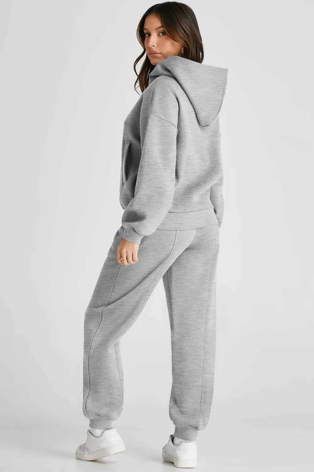 Comfortable grey tracksuit for women featuring a hooded sweatshirt and matching pants