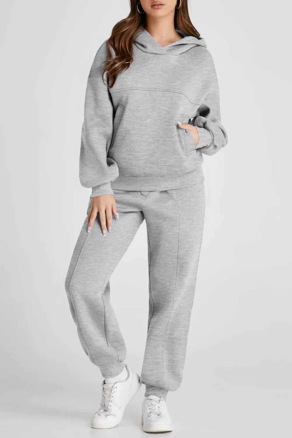 Trendsi grey tracksuit for women featuring a cozy hooded sweatshirt and matching jogger pants