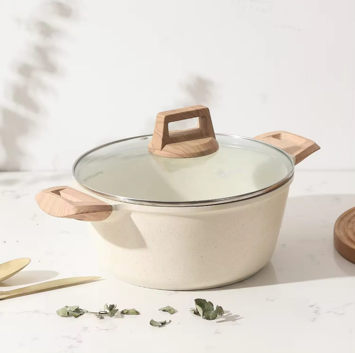 Medical stone non-stick cookware set featuring a pot with a glass lid and wooden handles for easy cooking