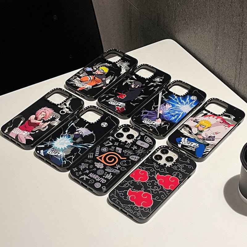 Collection of Naruto iPhone cases featuring various characters and designs on a tabletop