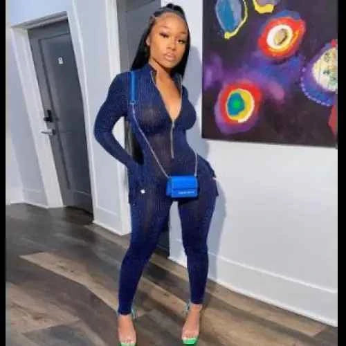 Stylish Navy Blue Jumpsuit Women featuring a flattering silhouette and paired with a blue handbag