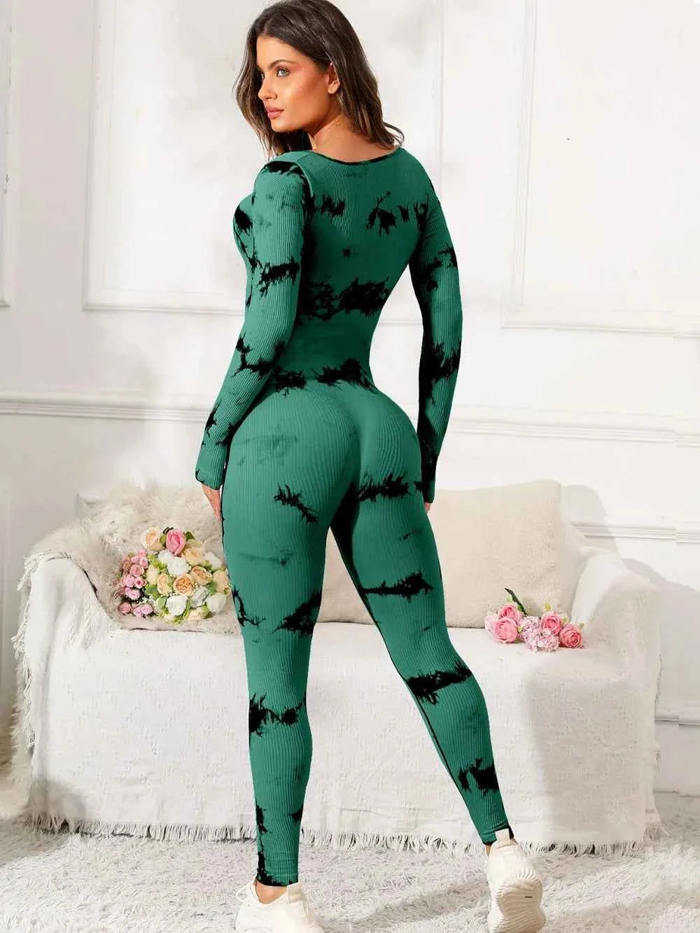 Premium fitness jumpsuit in green tie-dye pattern, perfect for workouts and casual wear