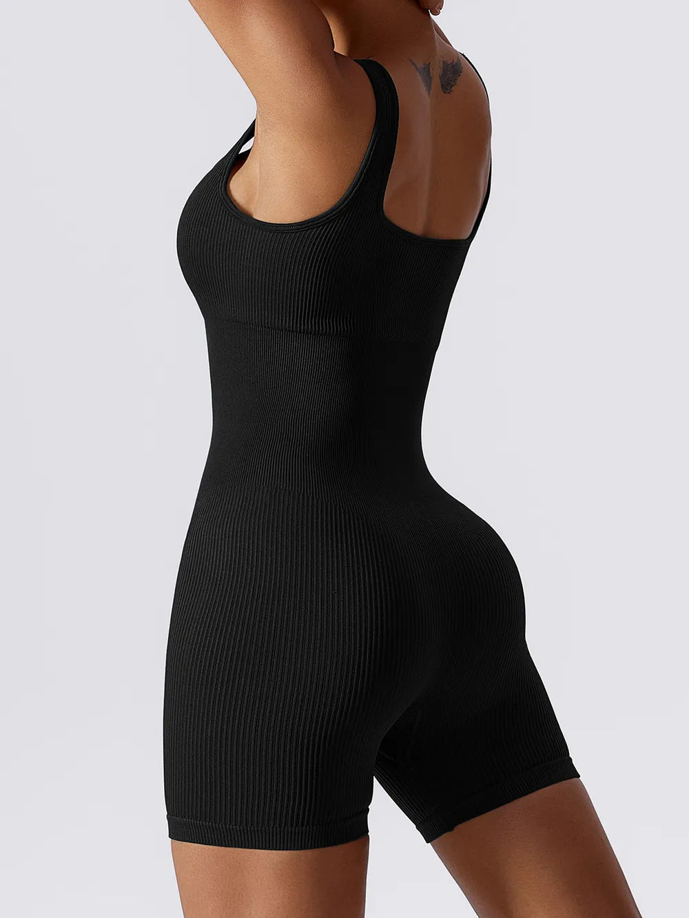 Trendsi black ribbed sleeveless romper with a fitted design for a sleek look