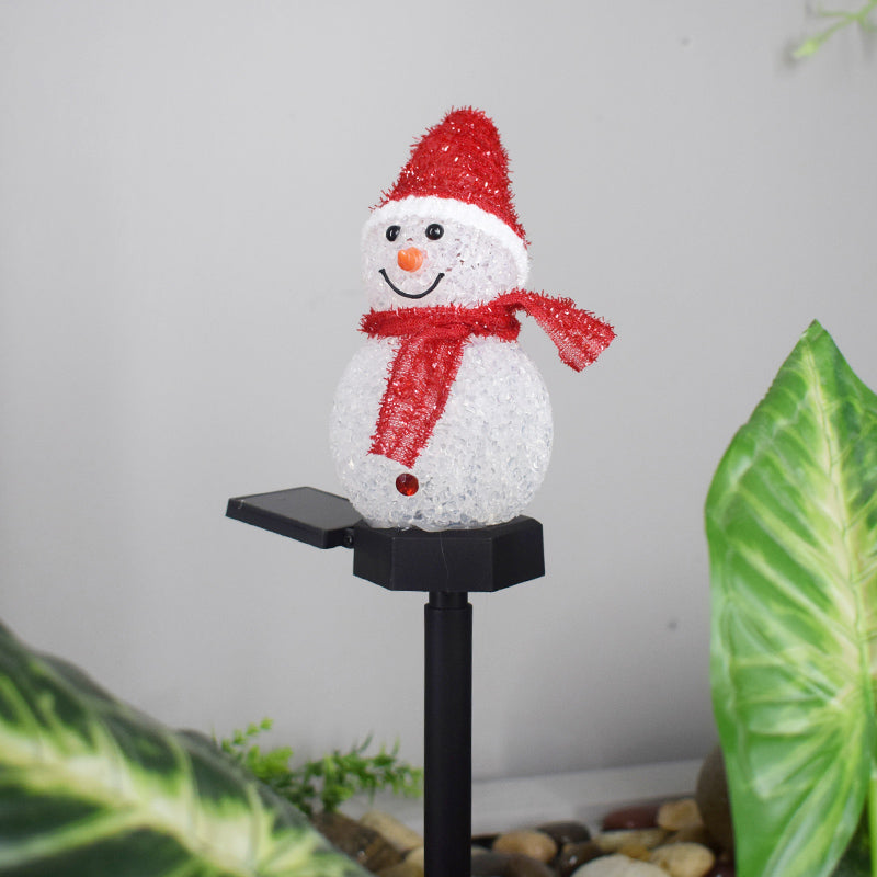 Solar snowman garden lamp with a cheerful snowman wearing a red hat and scarf for outdoor decor