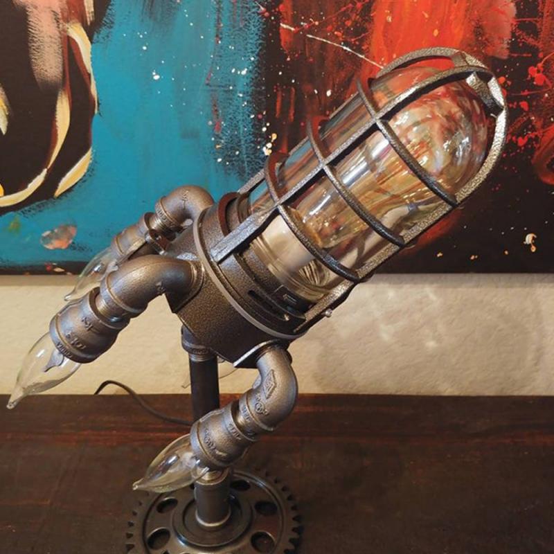 Steampunk rocket lamp decor featuring a metallic design with glass accents for unique home lighting