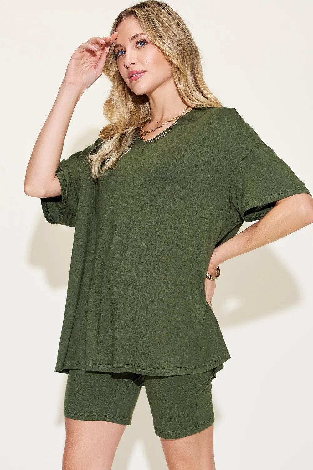 Trendy lounge wear for women featuring a loose olive green top and matching biker shorts