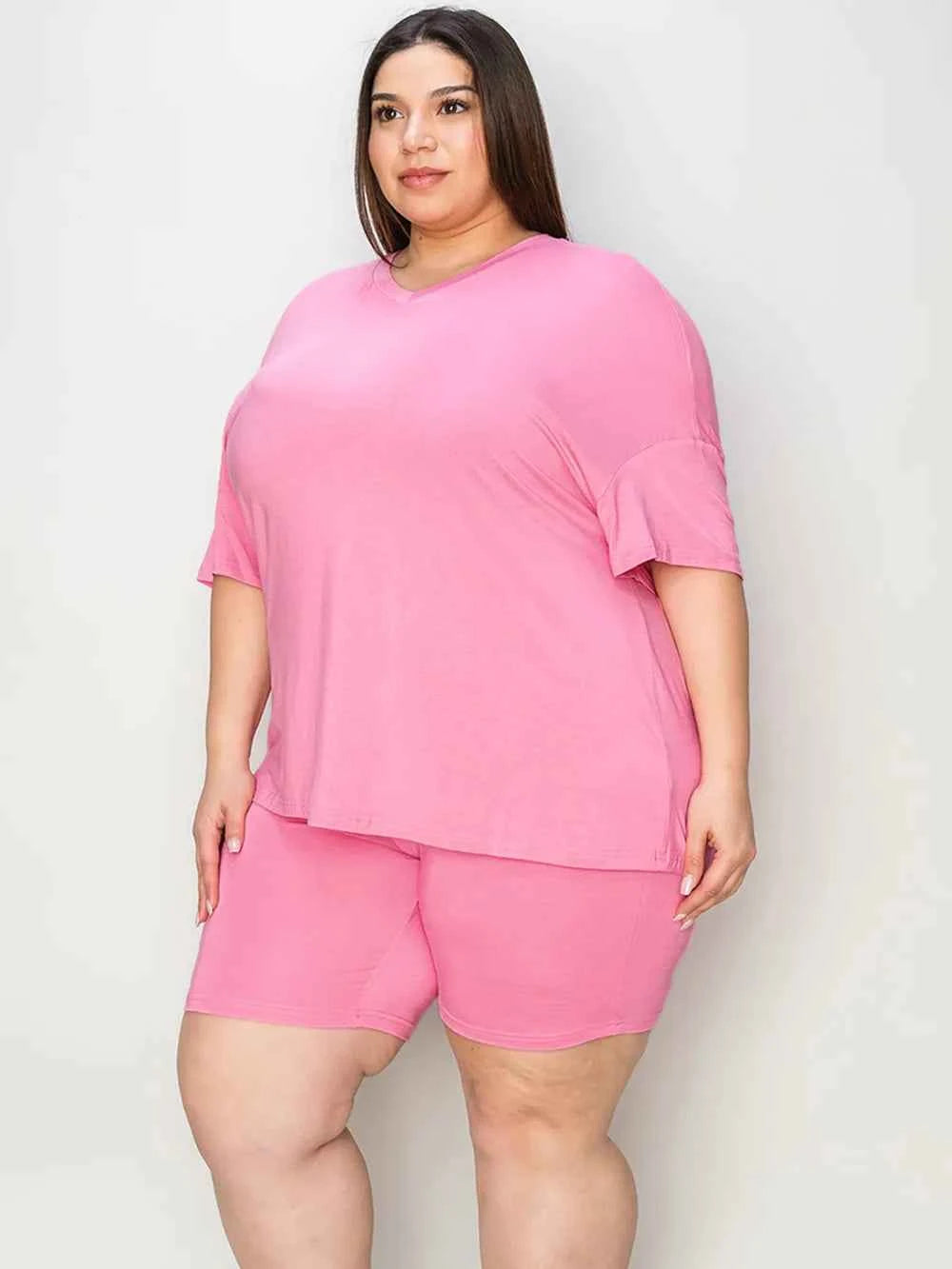 Plus size trendy lounge wear for women in pink featuring a soft oversized top and matching shorts