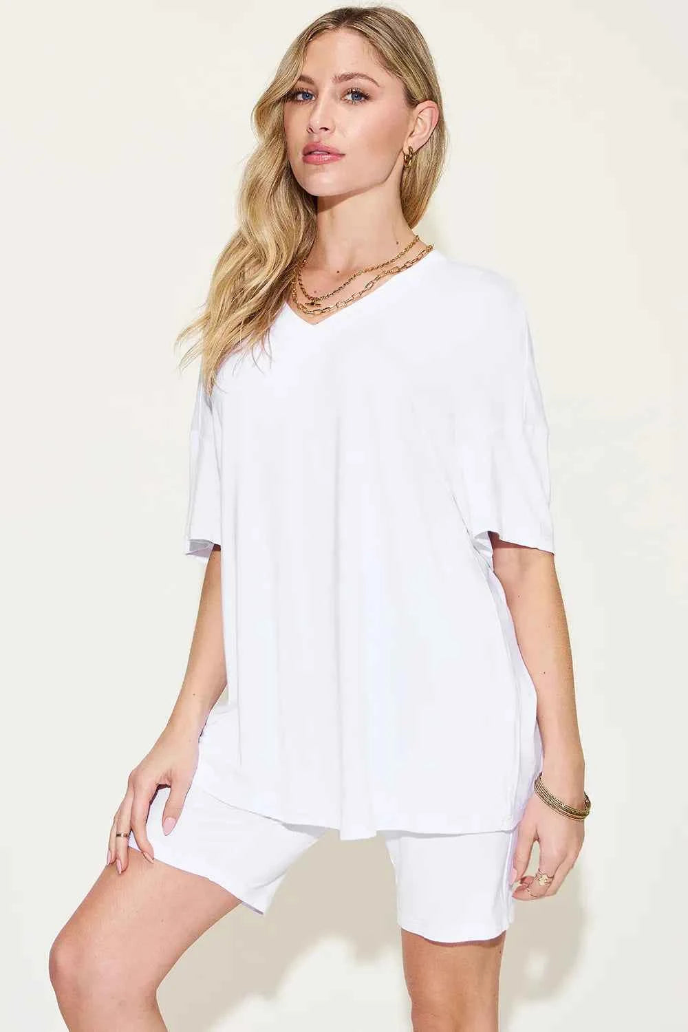 Stylish white trendy lounge wear for women featuring a loose fit tee and matching shorts