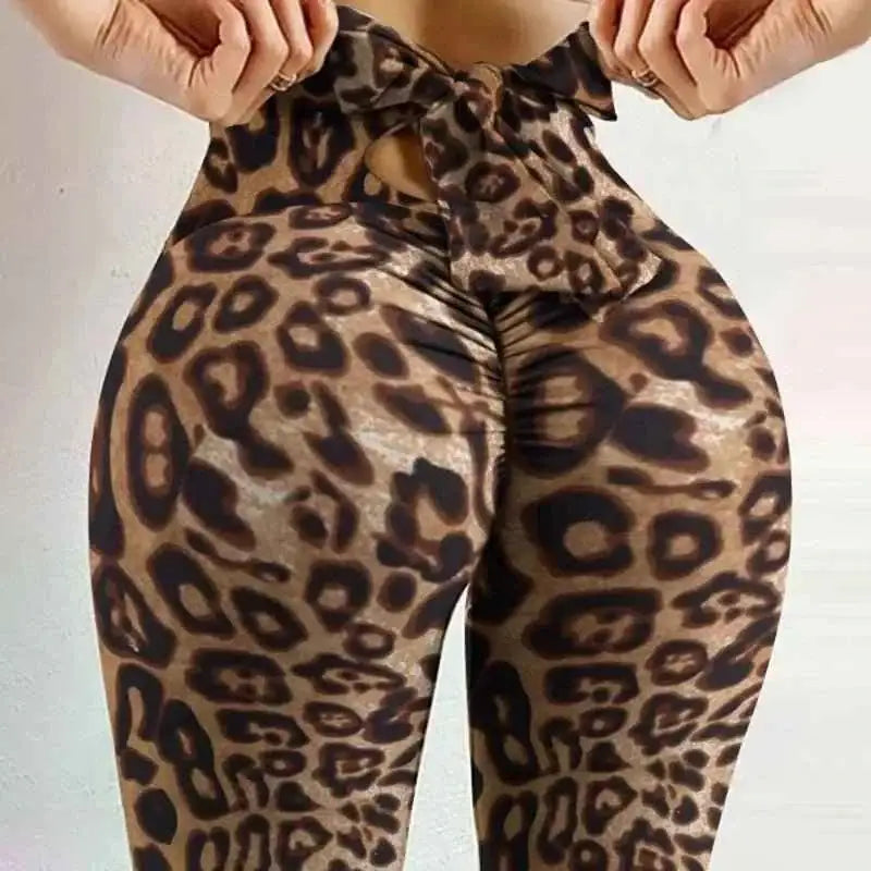 Stylish women's bowknot yoga pants with leopard print design for trendy workouts