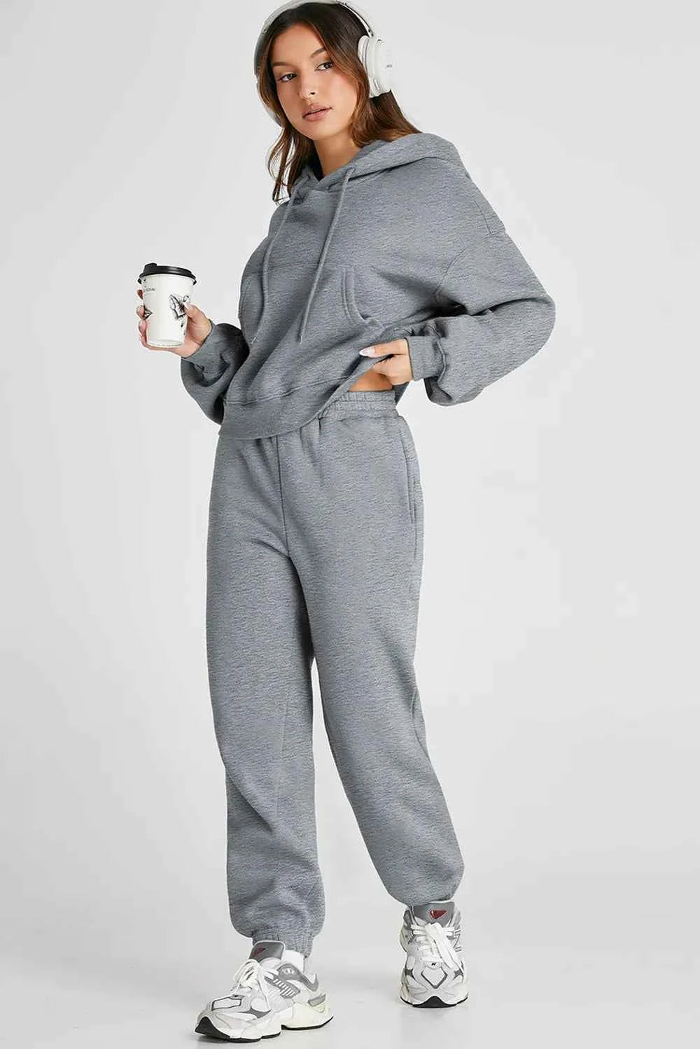 Trendy women's casual activewear set in gray featuring a hoodie and matching sweatpants
