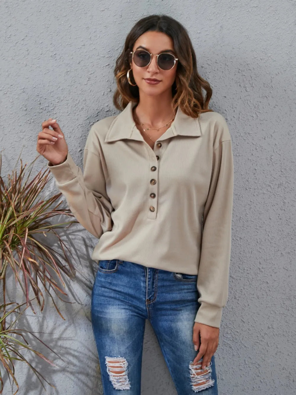Stylish women's classic blouse in beige with button detailing and relaxed fit for casual wear