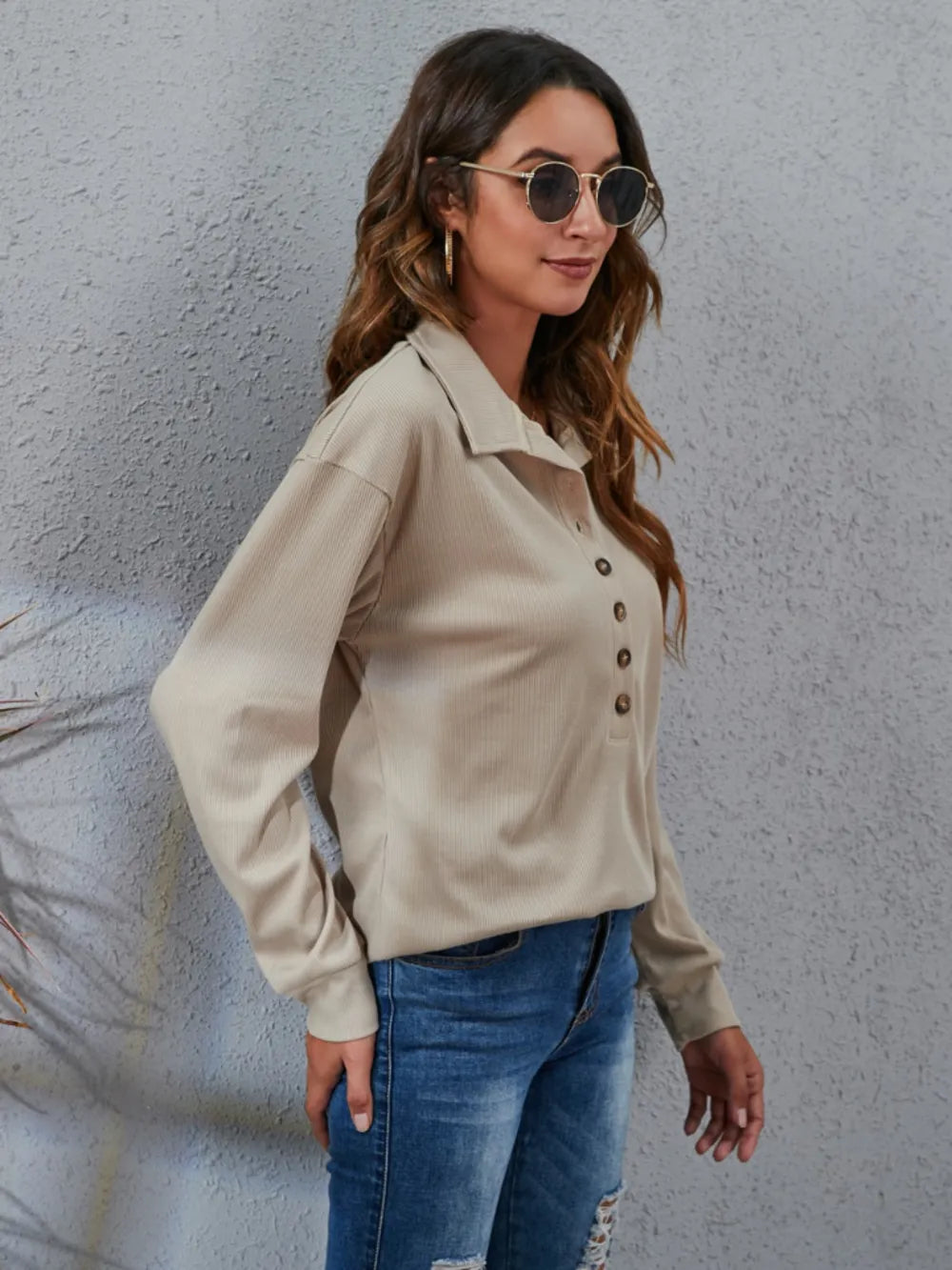 Elegant women's classic blouse in beige with button detail, perfect for casual outings