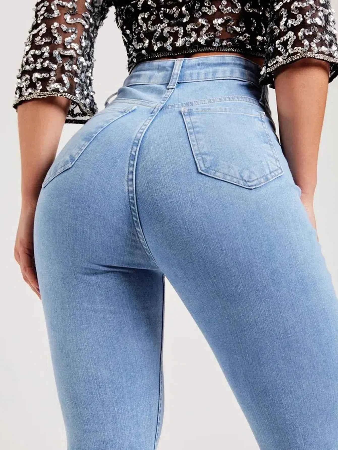 Stylish women's vintage denim pants in light blue with a high-waisted fit for a trendy look